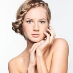 Portrait of young woman with braid hairdo