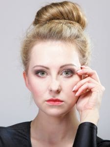 young beautiful girl make up and hair bun