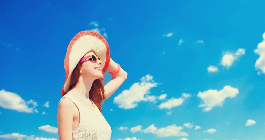 Redhead girl on the beach in spring time.